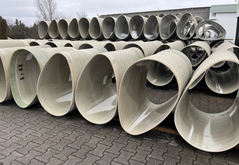Large batch of Budaplast GRP non-circular pipe in storage yard